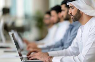 Men Working on Laptops in Office photo