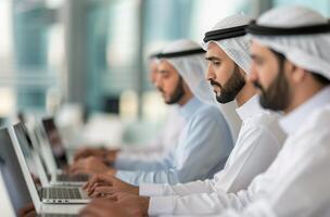 Men Working on Laptops in Office photo