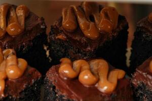 a plate of chocolate cake with caramel frosting photo