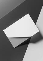 top view of white business card on grey background for mockup photo