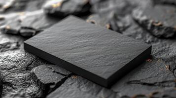 Blank black business cards on stone background. Mockup photo