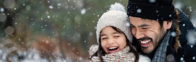 Father and Daughter Laughing in the Snow photo
