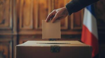 Person Casting Ballot in Front of French Flag photo