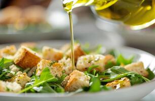 Olive Oil Drizzled Over Croutons and Greens photo