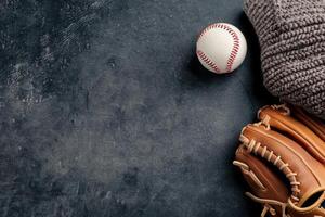 Baseball Glove and Ball on Field photo