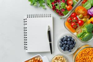 Healthy Meal Prep With Notebook and Pen photo