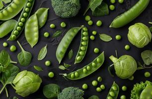 Fresh Green Peas and Pods on Black Background photo
