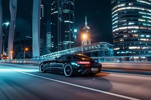 Powerful Luxury sports car driving through modern urban highway interchange with illuminated skyscrapers photo