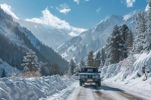 Utility Compact truck driving through snow covered mountain pass with pine trees laden with snow and clear blue sky Background photo