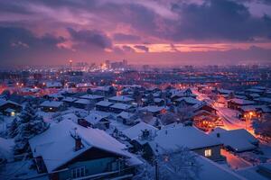Snow covered rooftops and colorful city lights glowing under vibrant evening sky background photo