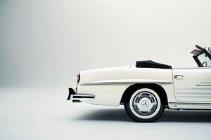 Timeless vintage roadster in pristine condition on plain white background emphasizing its classic design background photo