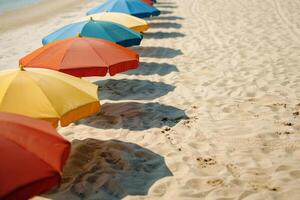 Calmness at the beach with row of beach umbrellas casting colorful shadows on the sand photo
