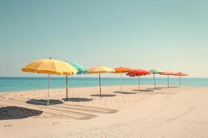 Calmness at the beach with row of beach umbrellas casting colorful shadows on the sand photo