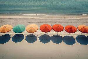 Calmness at the beach with row of beach umbrellas casting colorful shadows on the sand photo