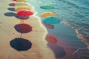 Calmness at the beach with row of beach umbrellas casting colorful shadows on the sand photo