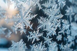 Frost patterns on window pane intricate ice crystals forming delicate designs against red background photo