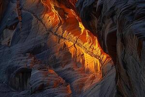 Patterns of light and shadow on canyon wall created by the setting sun background photo