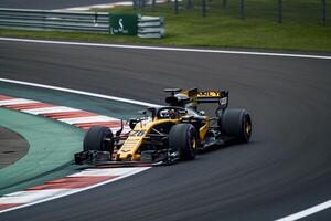Competitive Formula 1 Car Racing Background photo