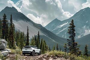 Adventure Electric SUV Parked at the Base of Mountain Trail with Rugged Terrain and Pine Forests  nature background photo