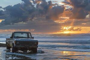 Adventure Compact Truck Parked at Beach with Waves Crashing on the Shore and Dramatic Sunset in the Background nature background photo