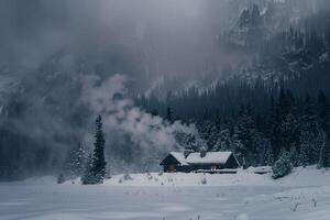 Dramatic Conceptual Nature of snowstorm enveloping mountain lodge with smoke rising from the chimney against snowy background photo