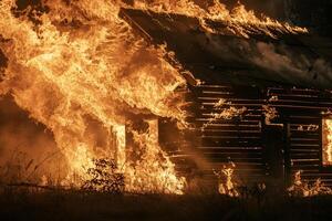 Flames Engulfing Wooden Cabin During Controlled Fire Safety Exercise Background photo