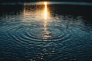 Seascape Sunlight Casting Intricate Patterns on the Rippling Surface of Lake nature background photo