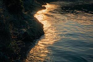 Seascape Sunlight Creating Golden Path on the Calm Surface of Secluded Bay nature background photo