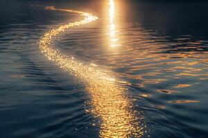 Seascape Sunlight creating golden path on the surface of calm lake  nature background photo