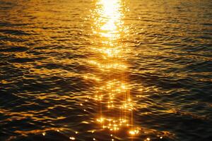 Seascape Sunlight creating shimmering path on the surface of the sea during sunset  nature background photo