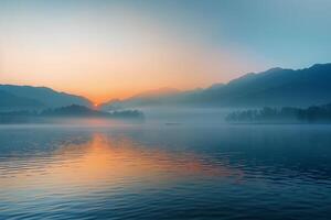 Landscape Ethereal foggy sunrise over serene lake with mist rising from the water and distant mountains silhouetted against the glow  nature background photo