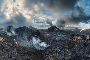 Landscape nature background Inspiring panoramic of volcanic landscape with steaming vents and rugged terrain under dramatic sky with swirling clouds photo