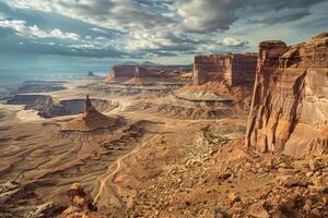 Vast Desert Landscape with Towering Rock Formations and Winding Canyon Under Dramatic Sky Background Nature photo