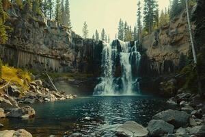 Majestic Waterfall Cascading Down Cliff Face into Crystal Clear Pool Surrounded by Towering Pine Trees   nature background photo