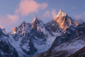 Majestic Mountain Range with Jagged Peaks and Glaciers Illuminated by Sunrise Glow   nature background photo