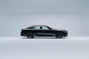 Stylish sedan parked on white studio background with clean and modern design background nature photo