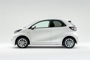 Compact City Car Displayed on White Studio Platform photo
