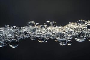 Abstract of Bubbles Trapped in Ice Creating Pattern Against Dark Background photo
