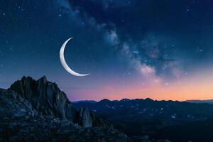 Crescent Moon with Starry Sky Over Mountain Range photo