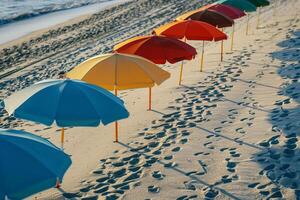 Beach Umbrellas Casting Shadows on Sand Nature Background photo