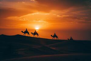 impressive beach with golden sands and towering dunes where camel riders are silhouetted against a fiery dramatic sunset sky creating a breathtaking visual. Nature Background photo