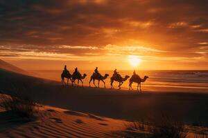 impressive beach Nature beauty with golden sands and towering sand dunes with camel riders silhouetted against a vivid fiery sunset sky for a dramatic effect. Nature Background photo