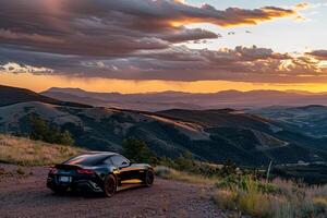 Sports Car Parked at a Scenic Overlook with Mountains and Valleys in the Background Nature photo
