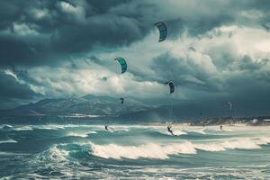 Kite Surfers Enjoying Waves in a Windy Coastal Bay with Dramatic Clouds in Tarifa Spain photo