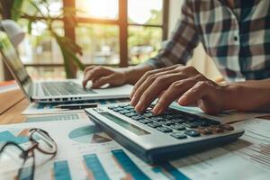 Hands Calculating Tax Returns with Calculator Background photo