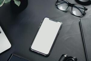 Smartphone on Desk with Office Accessories Background photo