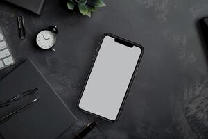 Digital Workspace with Smartphone and Business Accessories on Desk Background photo