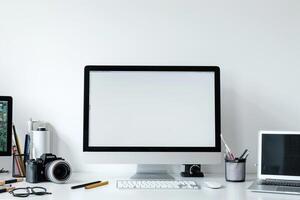 Computer Mockup Background on a white desk with  editing tools and accessories scattered Background photo