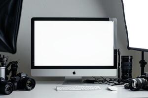 Computer Mockup Background on a white desk with various graphy gear and tech equipment Background photo