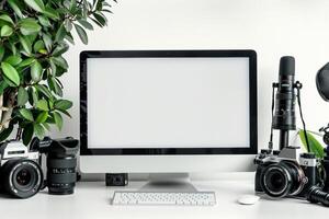 Computer Mockup Background on a white desk with various graphy gear and  tech Background photo